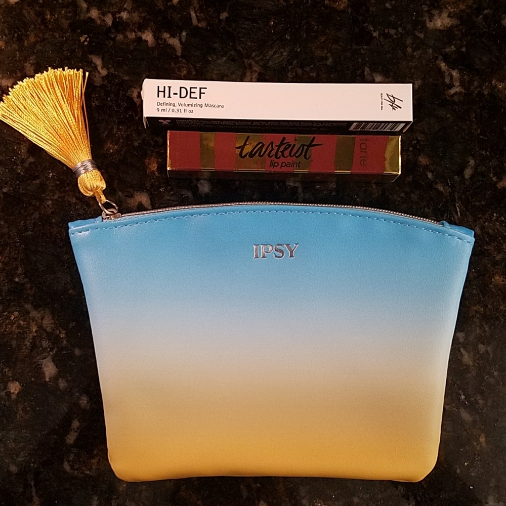 Mascara, lip gloss and bag